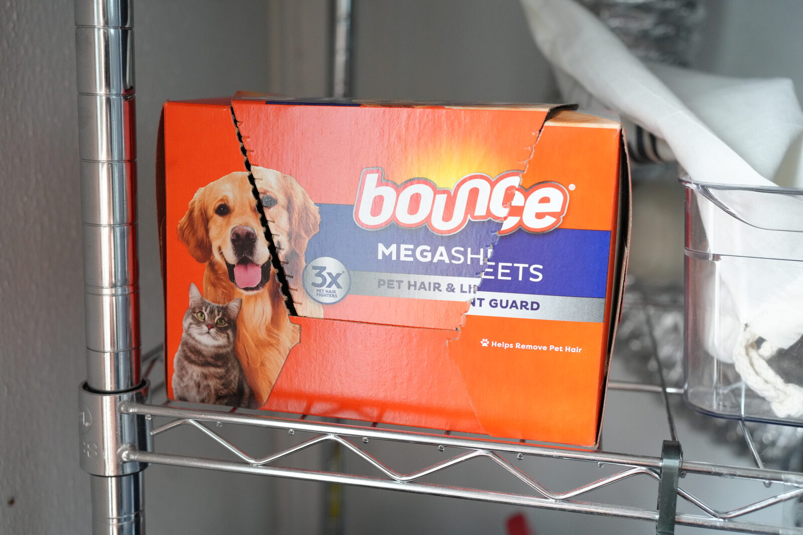 Bounce Pet Hair & Lint Guard mega sheets box on a wire laundry shelf