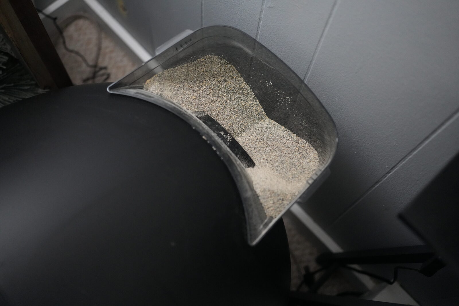 The Litter Hopper accessory mounted on top of a Litter-Robot 4, gravity-fed clear plastic hopper