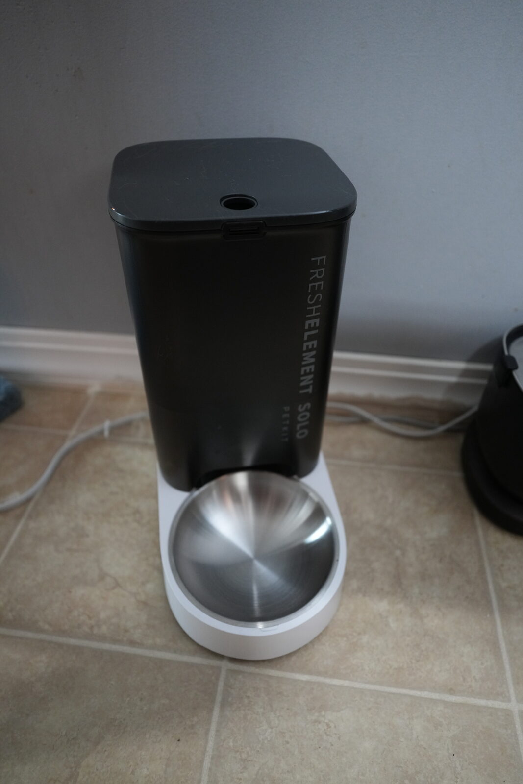 Petkit FreshElement Solo automatic cat feeder with stainless steel bowl on tile floor